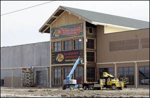 The 150,000-square-foot outdoors store, under construction in Rossford, is to open in the middle of June. Like its rival in Dundee, Mich., the chain is considered a tourist destination.