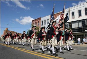 Members of the Colonial Williamsburg Fife and Drum Corps of Williamsburg, Va., perform in Perrysburg in 2004.