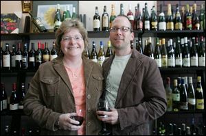 Kimberly and Doug Reinhart in Calvino s wine shop, one of the stops for the UT progressive dinner.
