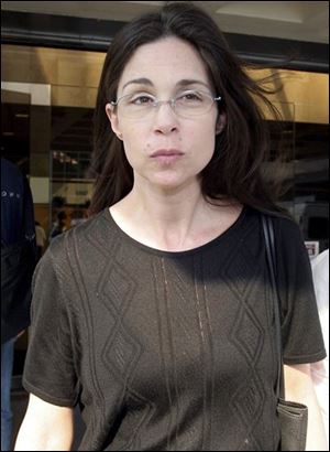American Nancy Kissel walks out of Hong Kong's High Court in this Aug. 2, 2005 file photo. 