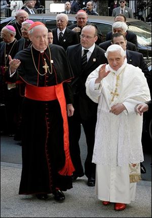 Pope Benedict XVI, right, is escorted by Cardinal Edward Egan, archbishop of New York, left, as he arrives at St. Patrick's Cathedral in New York, Saturday, April 19, 2008. 