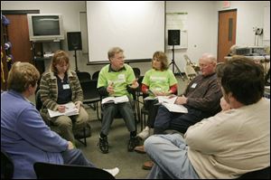 Wendylea Wyandt, left, John and Marcia Knollman, and Andy Kandik in s 'Bible in 90 Days' session at the Waterville Fire Station. The Knollmans got the program started and led discussion meetings in Waterville on five different nights every week for three months.