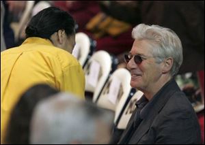 Actor Richard Gere attended and paid close attention to His Holiness the Dalai Lama's first session in Crisler Arena.