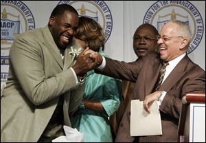 The Rev. Jeremiah Wright Jr., right, the former pastor of Democratic presidential hopeful Sen. Barack Obama D-Ill., laughs with Detroit Mayor Kwame Kilpatrick, left, at the Detroit NAACP's 53rd annual Fight for Freedom Fund Dinner in Detroit on Sunday. Second right is the Rev. Wendell Anthony, president of the Detroit Branch of the NAACP. (ASSOCIATED PRESS)
<br>
<img src=http://www.toledoblade.com/graphics/icons/video.gif> <b><font color=red>AP VIDEO</b></font color=red>: <a href=