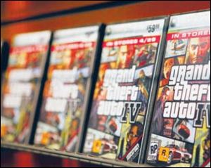 Grand Theft Auto IV video game
boxes are displayed on a rack.