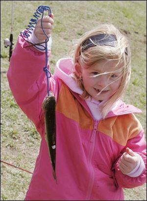 nbrw trout01p        4/26/2008    blade photo by herral long   Lydia Yoder 6  of Delta holds her catch       fishermen, will circle around the shores of Olander Lake for the Olander Park System's annual fishing derby day. Please get several photos for photo package for West; event draws youngsters from across area and we can run photos in other sections as well if you happen upon families such as from South Toledo area, East, etc. Michigan kids could be there as well. ___________