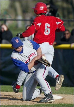 Knights first baseman R.J. Rios can't come up with the throw, and Central's Kyle Burkhardt was safe with an infield hit.