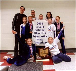 The 2008 Level 6 Gynastics team: Front, Emily McLargin and Emily Woodruff. Standing, coach Dustin Costanzo, Ashley O'Neal, Erin Gyurke, coach Nick Distel, Elizabeth Mosher, coach Alesha Martinez, Samantha Sperlik, and Erica Schlets.