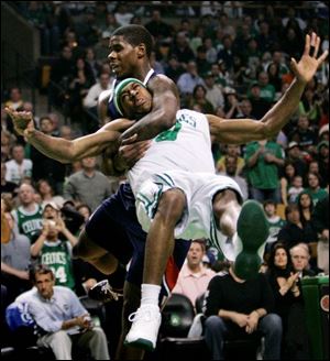 Hawks forward Marvin Williams commits a flagrant foul on the Celtics' Rajon Rondo. Williams was ejected from the game.