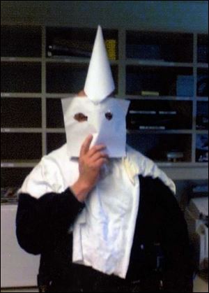 This is a photo taken by Trooper Eric Wlodarsky of Trooper Craig Franklin in a Klu Klux Klan-like outfit.