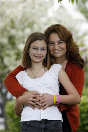 Brynn Peper, with her mom, Sheryl, celebrates her birthday every year on Mother's Day, not just on the anniversary of her birth, May 11, 1997. Neither mom nor daughter minds sharing her special day. The close-knit pair from rural Haskins, Ohio, share everything anyway, right down to their shoes.