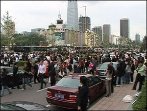 In this image from TV showing a street scene in Beijing, China, shortly after an earthquake, made shortly after a 7.8 magnitude earthquake struck western China on Monday. In the Chinese capital Beijing, about 930 miles (1,500 kilometers) from the quake epicentre, buildings swayed for more than two minutes and people were evacuated from buildings, but there were no immediate reports of damage or injuries. (ASSOCIATED PRESS)
<br>
<img src=http://www.toledoblade.com/graphics/icons/photo.gif> <b><font color=red>VIEW</b></font color=red>: <a href=