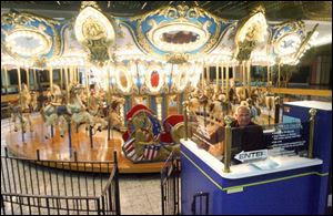 Paul Misch operates the mall's carousel. Few people ride the carousel these days, he said. 