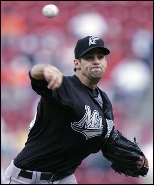 Burke Badenhop delivers a pitch against the Reds. He pitched well but was not involved in the decision.
