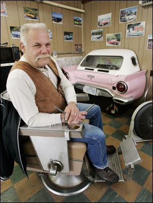 Rob Hoobler maintains a biker/hotrod theme in his shop on Summit Street in Point Place.