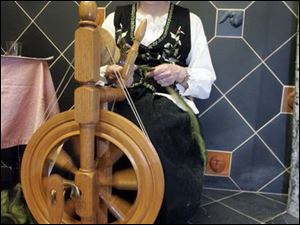NBRN lost15p  Linda Kruzynski, of Temperance, spins wool into material for a scarf. The Monroe County Library System presents Lost Arts IV, with demonstrations of arts from the past, at the Bedford branch of the  library in Bedford, Michigan on May 10, 2008. Exhibits include woodcarving, weaving, quilting, spinning, etc.  The Blade/Jetta Fraser