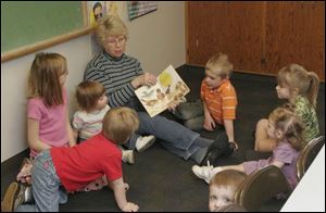 Lola Nelson reads to children in a recent 'Story Time with Lola' session at Zoar Lutheran Church in Perrysburg.