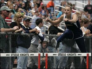 Woodmore's Chelsey Marquette heads to victory in the 300-meter hurdles at the SLL meet. She also won the 100 hurdles. 