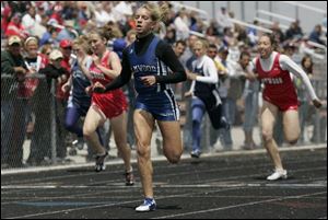 Elmwood's Katie Reiser, the SLL girls performer of the year, wins the 100-meter dash. The sophomore also won the 200.