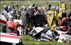 Society for Creative Anachronism members in a battle at Fort Meigs.