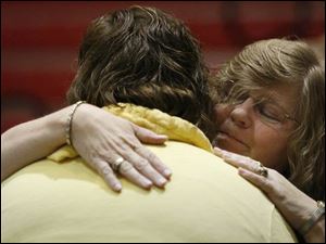 Debra Payne, Carrie Payne's mother, hugs Carrie's best friend, Shelby Routt. (BLADE PHOTOS/JEREMY WADSWORTH)
<br>
<img src=http://www.toledoblade.com/assets/gif/weblink_icon.gif> <font color=red> <b>ALSO</font color=red></b>: <a href=" /apps/pbcs.dll/article?AID=/20080524/NEWS17/805240362" target="_blank "><b>Southwyck Mall to close by June 30</b></a> 