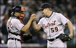 Detroit Tigers closer Todd Jones (59) is congratulated by catcher Brandon Inge after the team's victory over the Seattle Mariners in a baseball game Friday, May 30, 2008, in Seattle. The Tigers won 7-4.