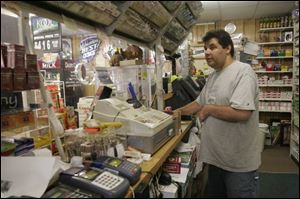 Nabil Shaheen, owner of Nabil's Quick Stop on Dorr Street, says the letter from the Toledo Police Department, which threatens to jail store owners who fail to submit an application for a license, is harassment and intimidation.