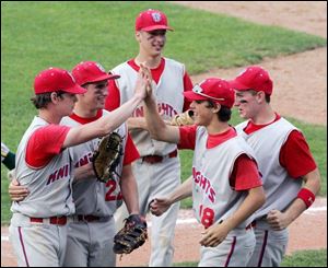 St. Francis pitcher Alex Radon, left, is congratulated by his teammates after he picked up the victory over Clay last night.