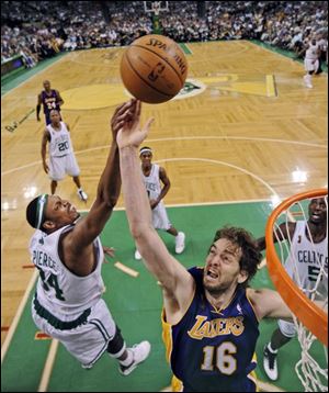 Boston Celtics' Paul Pierce (34) and Los Angeles Lakers' Pau Gasol, from Spain, battle for a rebound in the second half of Game 2 of the NBA basketball finals Sunday in Boston. 