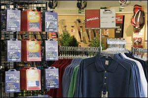 Shirts and gift cards await buyers at Golf Galaxy, where the owner likened Father's Day to Christmas.
