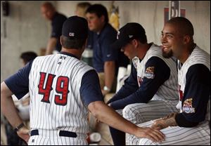 Mud Hens pitching coach A.J. Sager (49) talks with Joel Zumaya between the seventh and eighth innings last night at Fifth Third Field. Zumaya, in Toledo on a rehab assignment, threw 34 pitches.