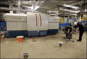 A technician tests one of the nine scanners that are part of Indianapolis' $24 million baggage system.