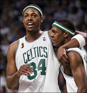 Boston's Paul Pierce, left, who had 17 points and was named most valuable player of the NBA finals, hugs Rajon Rondo. (ASSOCIATED PRESS)
<br>
<img src=http://www.toledoblade.com/graphics/icons/video.gif> <b><font color=red>VIDEO</b></font color=red>: <a href=