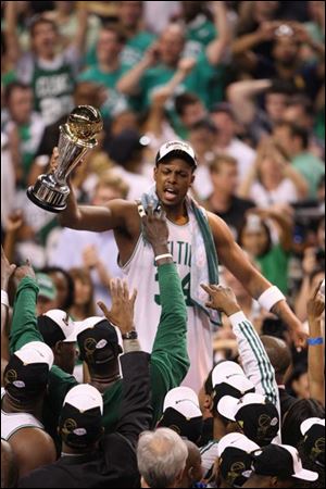 Paul Pierce holds his NBA finals MVP trophy after the Celtics whipped the Lakers for their first title since 1986.