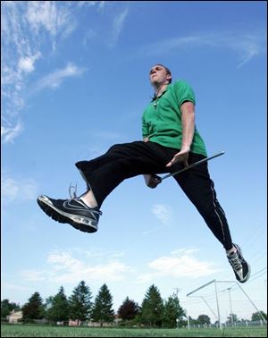 Drum Major Sean McGee makes a high-flying leap at band practice at Clay.