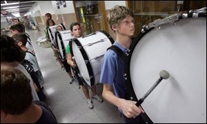 Jerin D'Anniballe beats his drum during band practice at Clay High School in Oregon. The students in the high school's marching band keep the beat alive for the school, and musicians start learning in fifth grade. The band travels every other year. In April, the band marched down Main Street at Disney World.