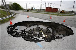 A sinkhole at State Rt. 64 and King Road has closed the roads since Feb. 1. The Ohio Department of Transportation expects the roads to reopen in July.