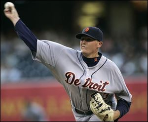 Ex-Mud Hen Eddie Bonine pitches for the Tigers against the Padres last night in San Diego.
