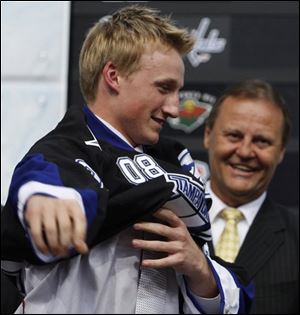 First overall draft pick Steven Stamkos puts on his Jersey from the Tampa Bay Lightning at the NHL draft in Ottawa, Canada on Friday, June 20, 2008. Stamkos, a six-foot, 176-pound forward from Toronto, had 58 goals in 61 games with the Sarnia Sting last season, the second-highest total in the Ontario Hockey League. 