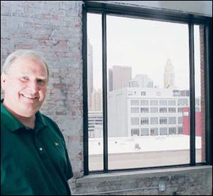 Jack Hoopes, a developer with Columbus Spectrum
Properties, hopes the view of downtown Columbus from this empty CityView at 3rd condominium will attract a buyer.