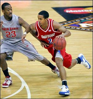 Brian Roberts dribbles past familiar foe David Lighty of Ohio State in the NIT. The three-time MVP at Dayton believes he has a chance to be picked up late in the second round.