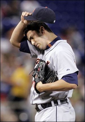 The Tigers  Armando Galarraga composes himself after giving up an RBI single to the Twins  Joe Mauer in the fifth inning.