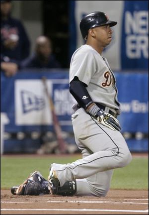 Carlos Guillen stares at Twins pitcher Glen Perkins after taking one high and tight.