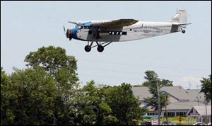 The Ford Tri-Motor heads back to the airport after a passenger flight. Island Airlines used the planes from 1936 to 1986.
