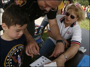 nbrw senior03p     6/28/2008        The Blade/Herral Long   Brent Smith 5  gets fingerprinted by deputy Bob Bevel  l Lynda Frass Frass stands by   all of toledo      The Eleanor Kahle Senior Center has planned its second annual  Community Day, which will feature appearances from Ronald McDonald,  Muddy, and Muddonna, and others. The Toledo Police and Fire Departmen  will participate as well. Please get some photos of the attractions.