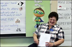 Sally Brinkman, a school readiness specialist with WGTE-TV, helps out with the program.