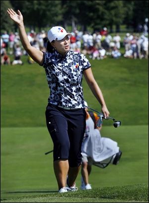 Se Ri Pak waves to the crowd at Highland Meadows as she approaches the 18th green where she finished off winning her fifth Jamie Farr Owens Classic. She has 24 LPGA career victories.