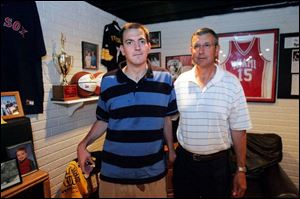 Jamie Mercurio, left, with his father, Jim, stands in front of some of the athletic awards and memorablia from Jamie's career. One of Jamie Mercurio's most productive games was a 1992 NCAA tournament match-up against North Carolina when he made eight 3-pointers and led Miami with 24 points.