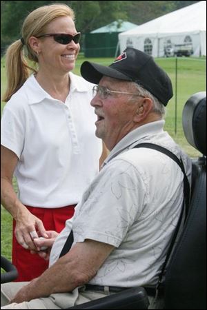 Joan Pitcock, the Farr champ in 1996, chats with fan Russel A. Rhodes yesterday at Highland Meadows during the Aquafi na Junior Pro-Am. The Farr was her only win in 350 LPGA events.