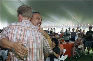Outgoing BGSU President Sidney Ribeau hugs Mike Marsh at the farewell picnic. Mr. Ribeau arrived in 1995.